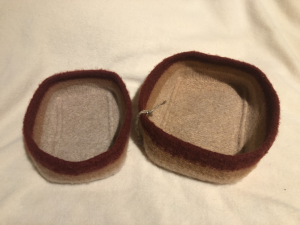 Two felted bowls in cream, tan and rust