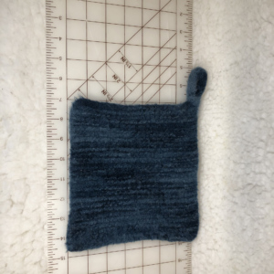 Felted hot mat in shades of blue