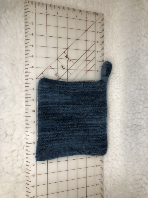 Felted hot mat in shades of blue